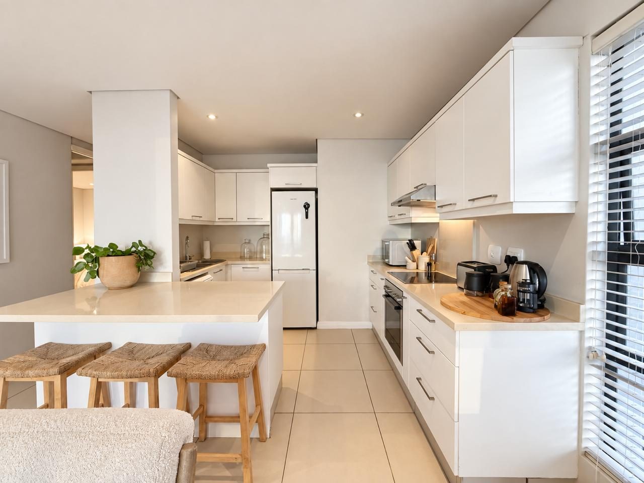 White kitchen with breakfast bar