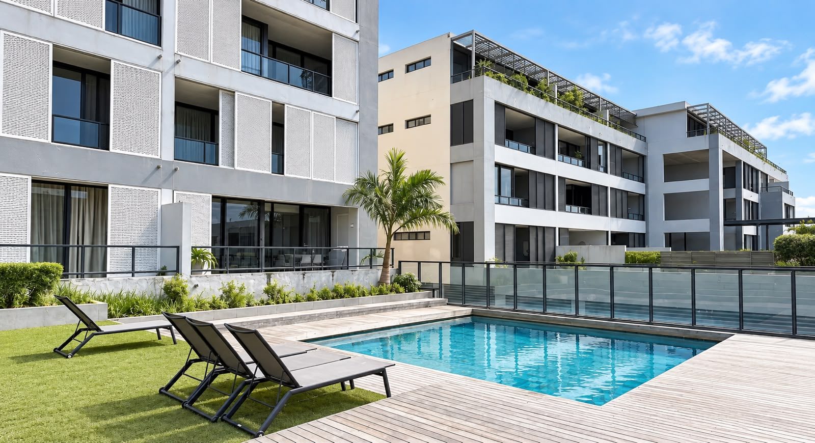 Pool and garden between the apartment blocks